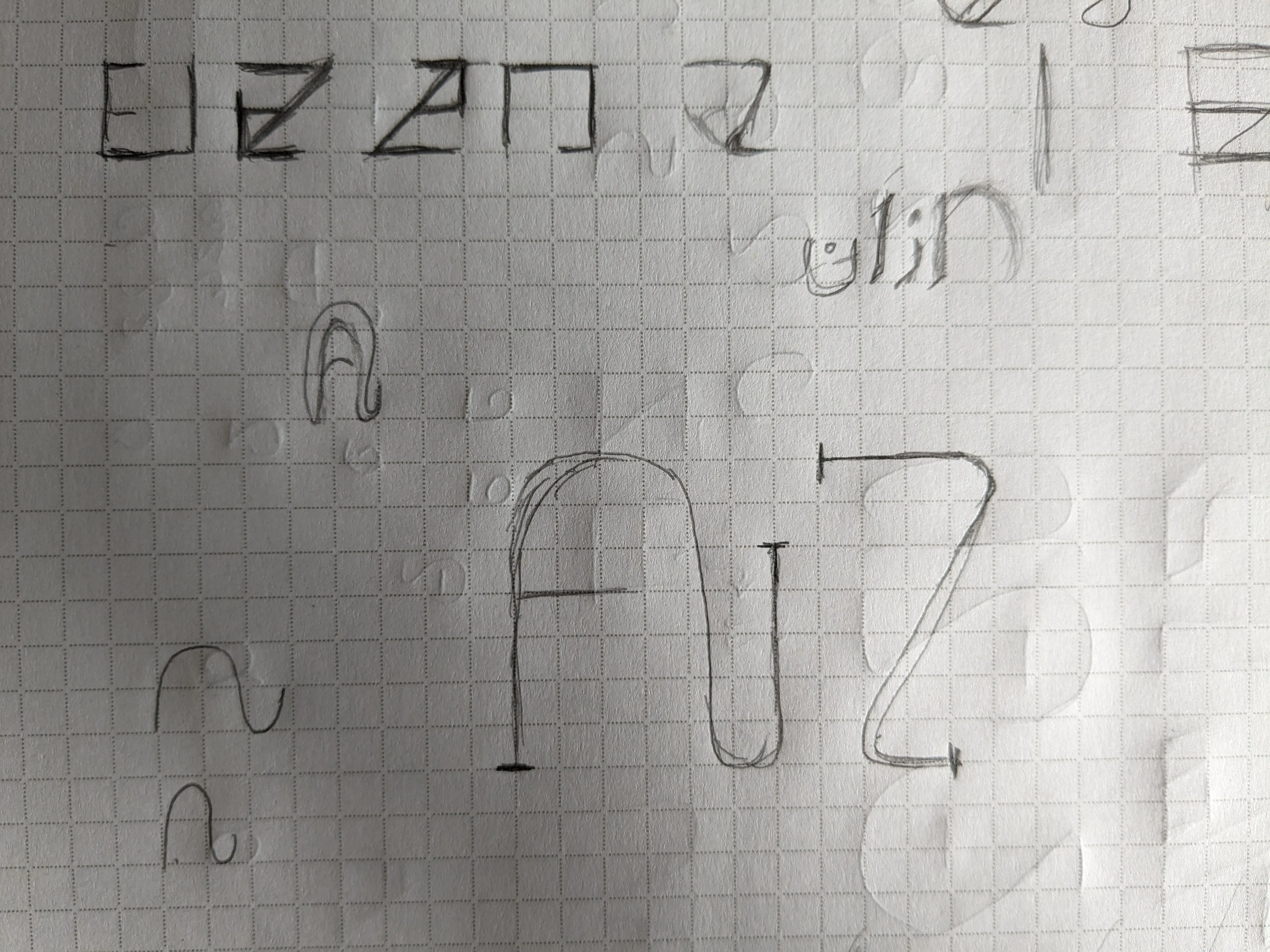 An ideation sketch on graph paper for the ambigram of my name